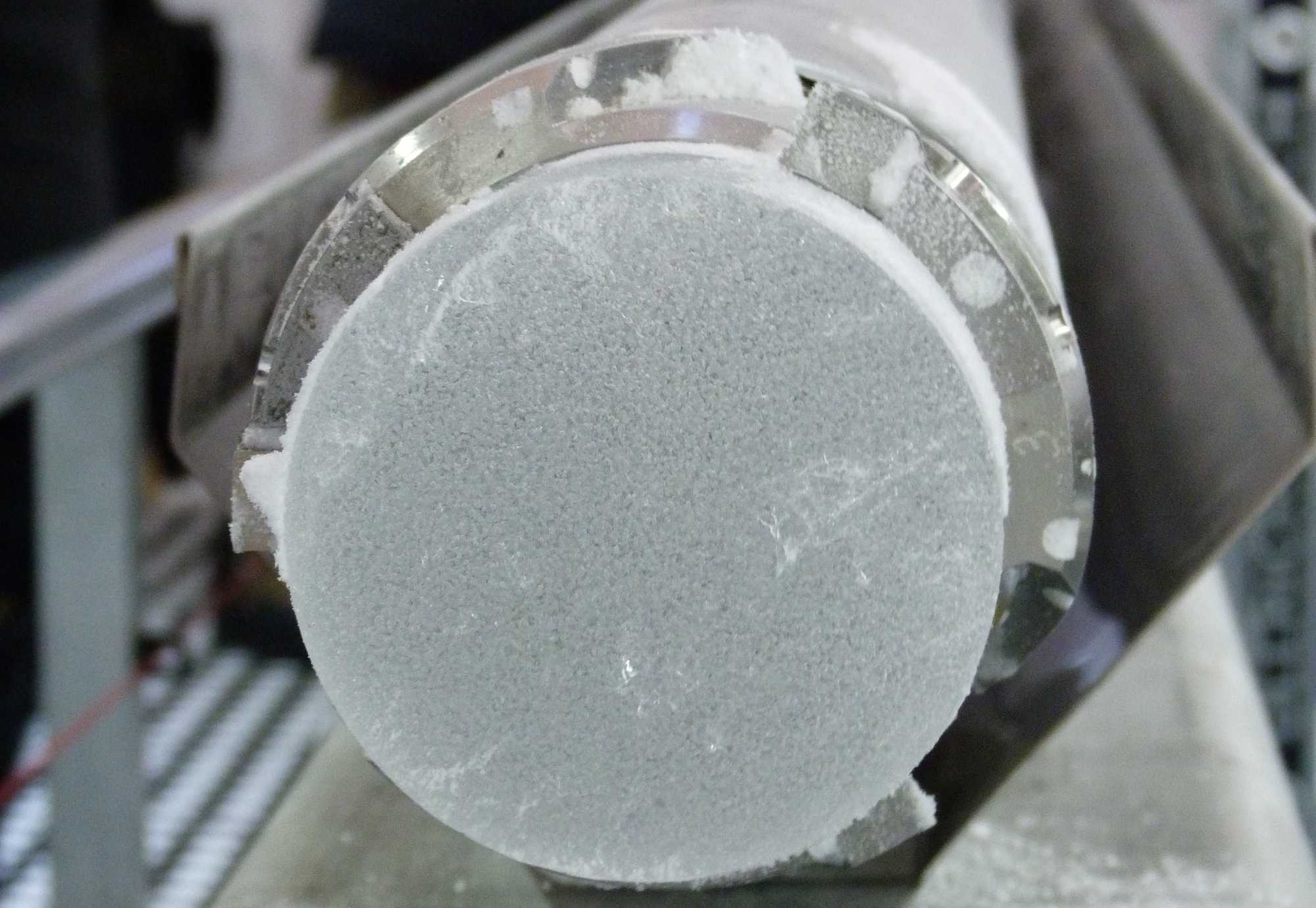 picture of cross-section of an ice core, with trapped air bubbles visible